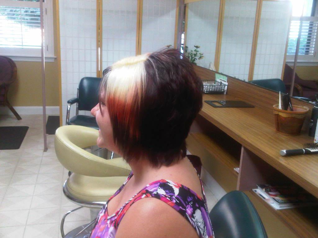 Two-tone blonde and red colour work on a dark bob