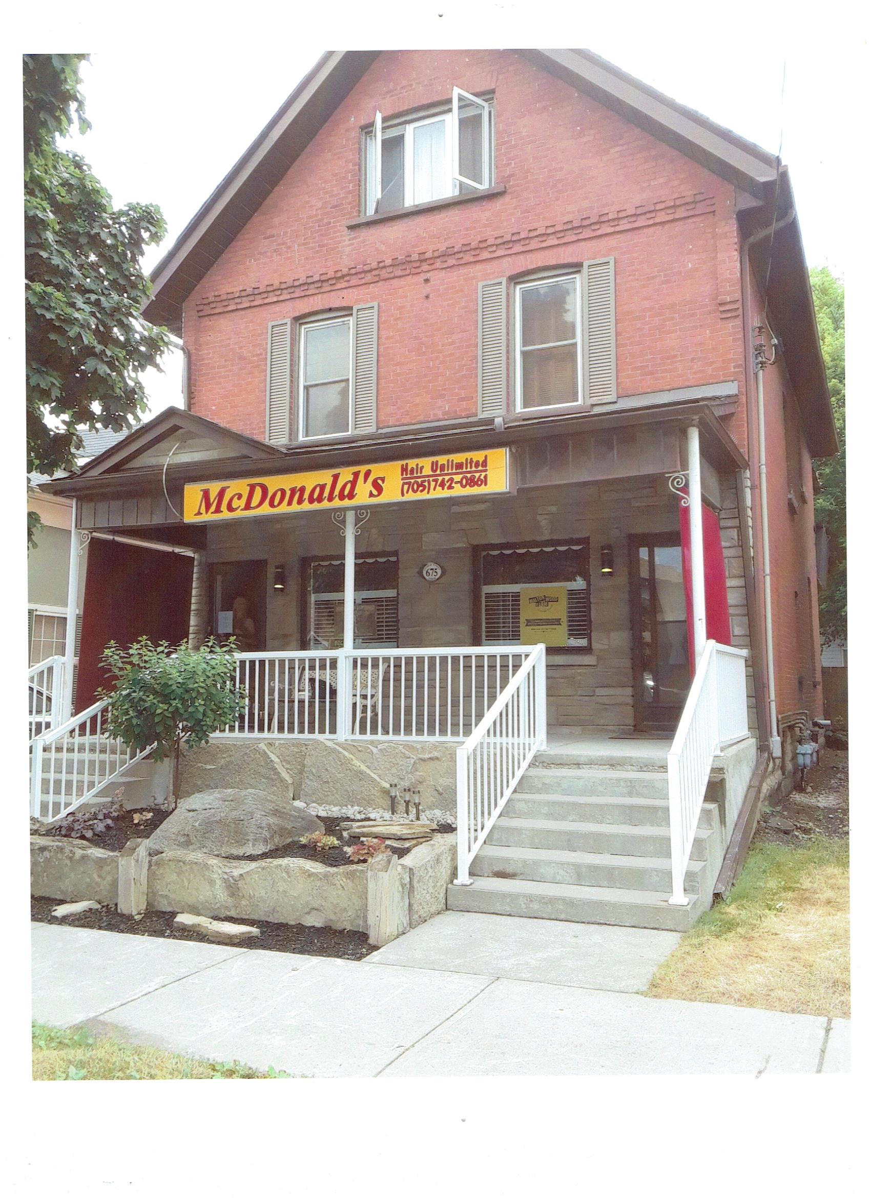 The red-brick Victorian home of McDonald's Hair Unlimited on George Street North, Peterborough